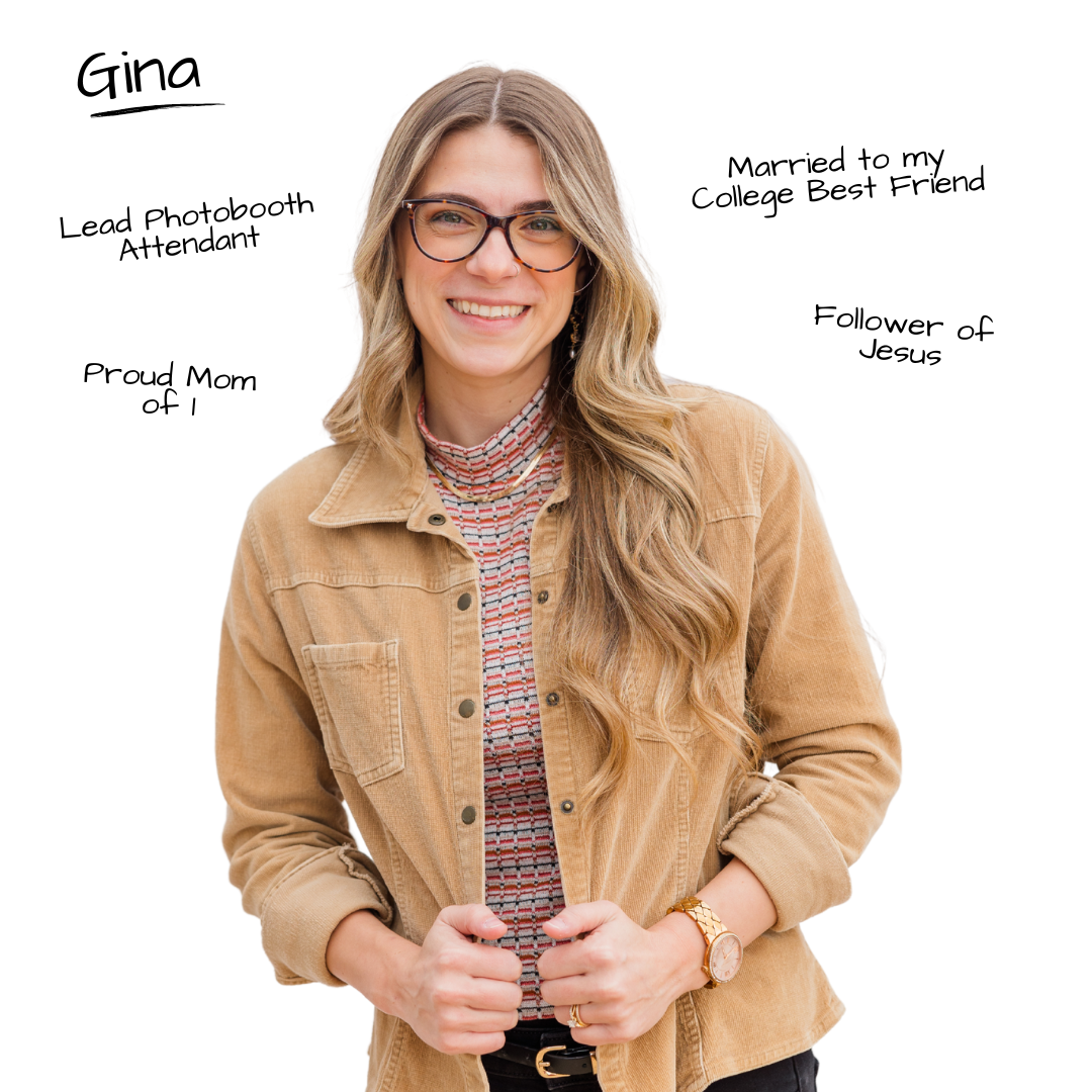 Smiling person wearing glasses, tan corduroy jacket and patterned sweater against white background.