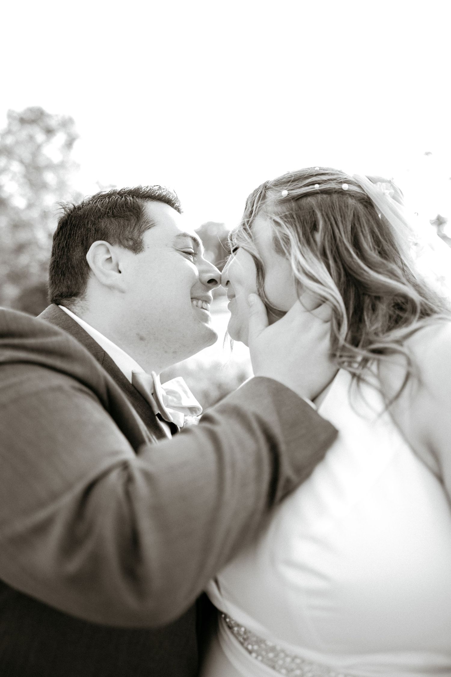 A tender black and white photo sequence capturing a romantic moment between newlyweds.