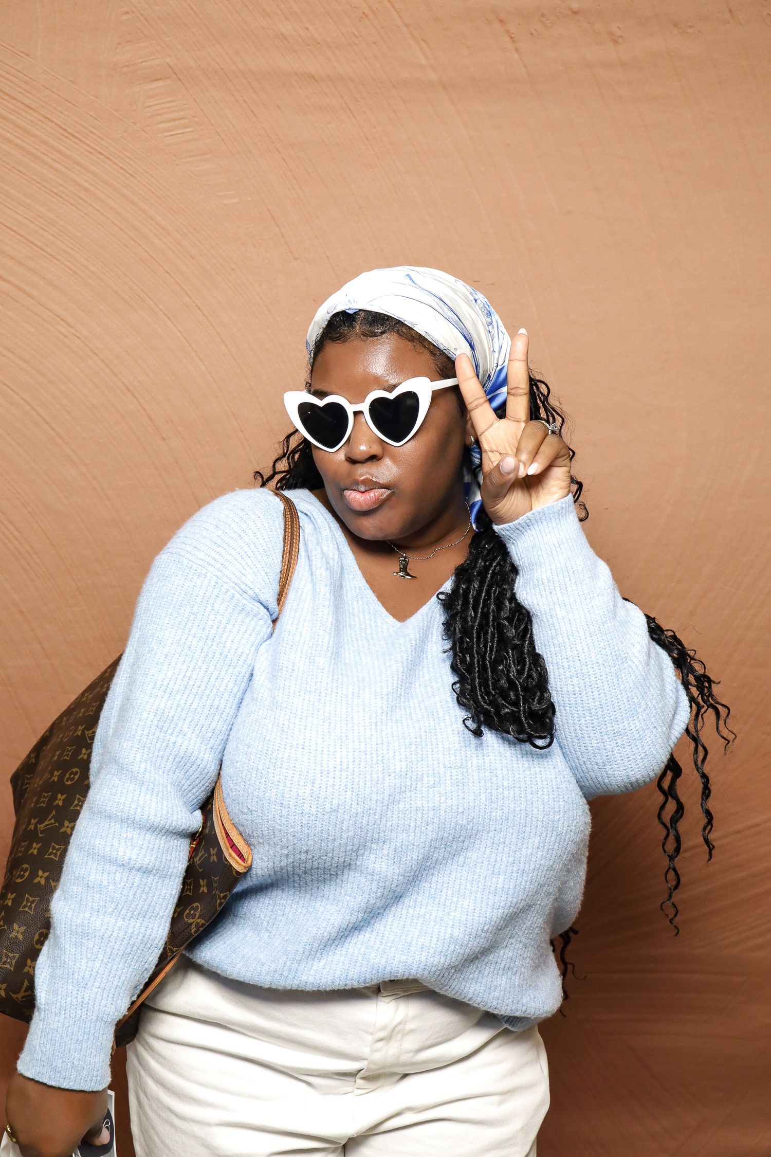 A sequence of photos showing a person in a white sweater and sunglasses posing against a brown background.