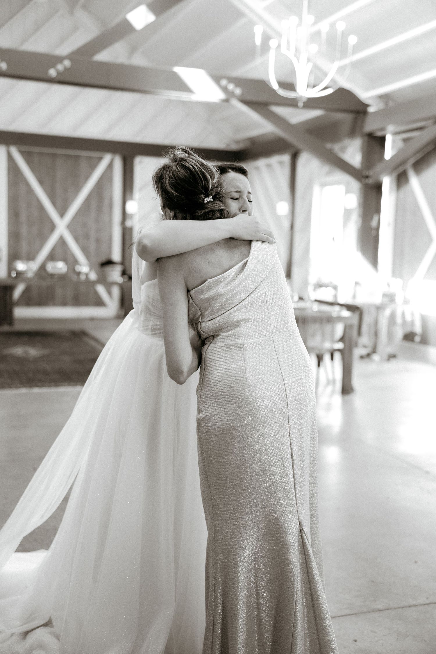 Artistic black and white wedding photos showing intimate moments between bride and attendant.