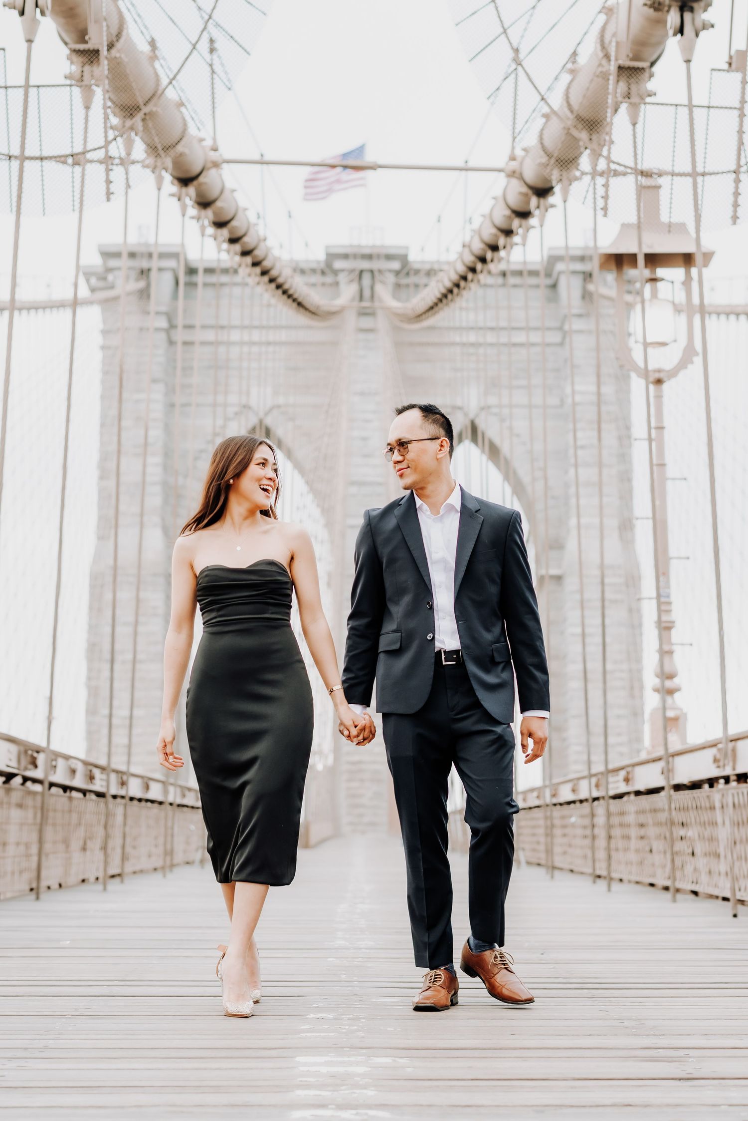 Couple engagement session romantic Brooklyn Bridge