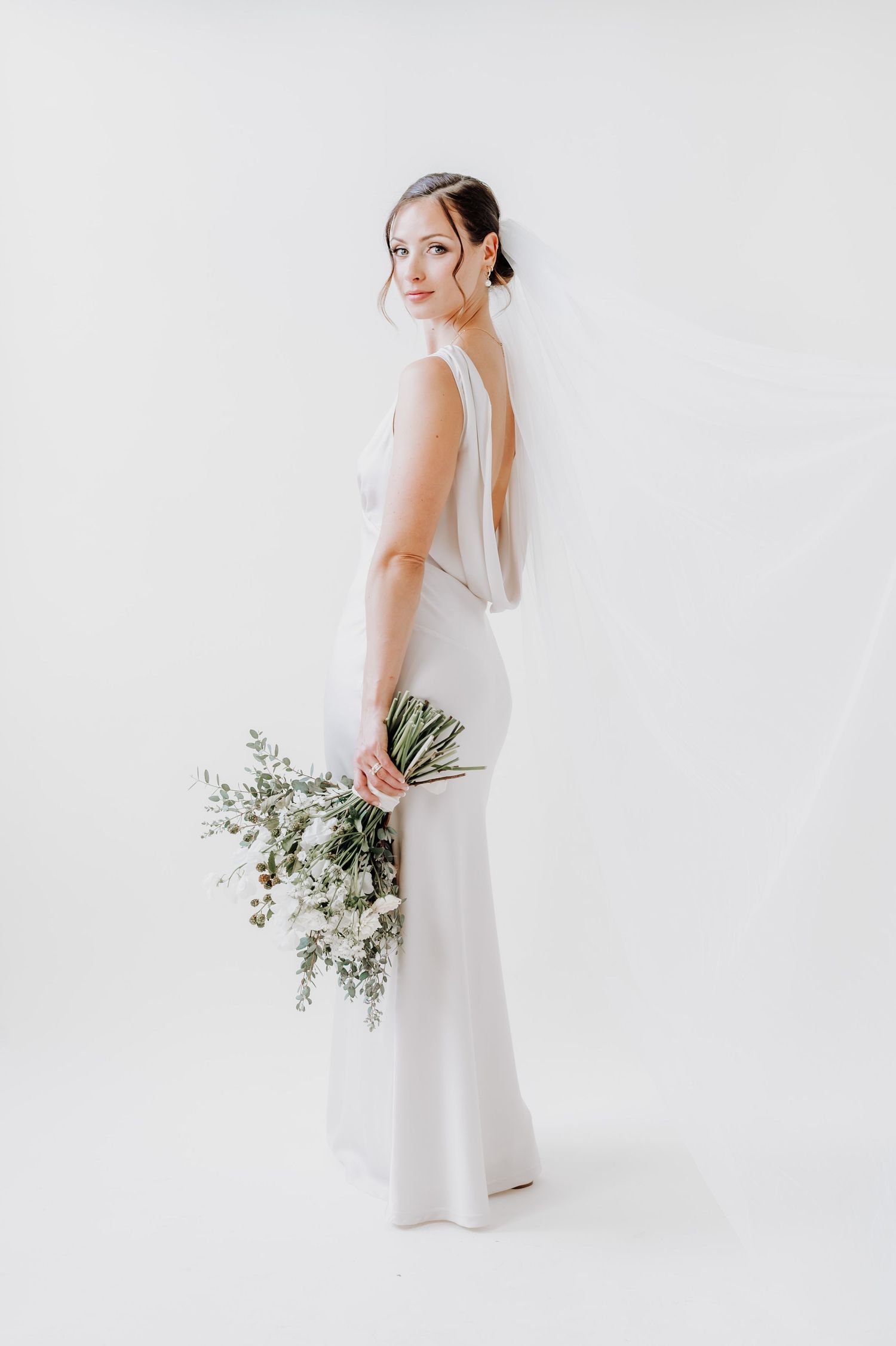 Bride portrait editorial wedding dress floral bouquet minimalist