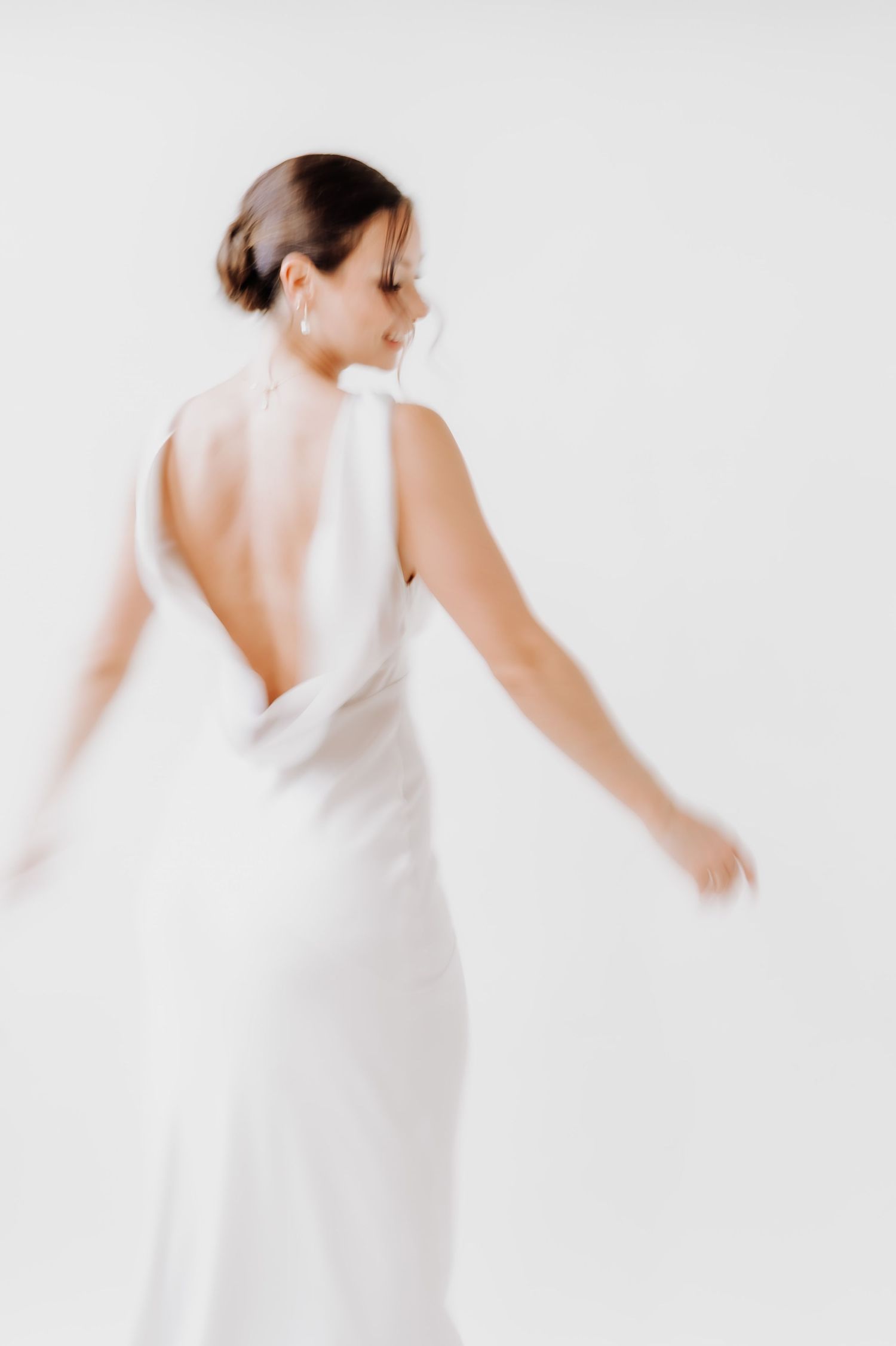 Bride dancing in white dress