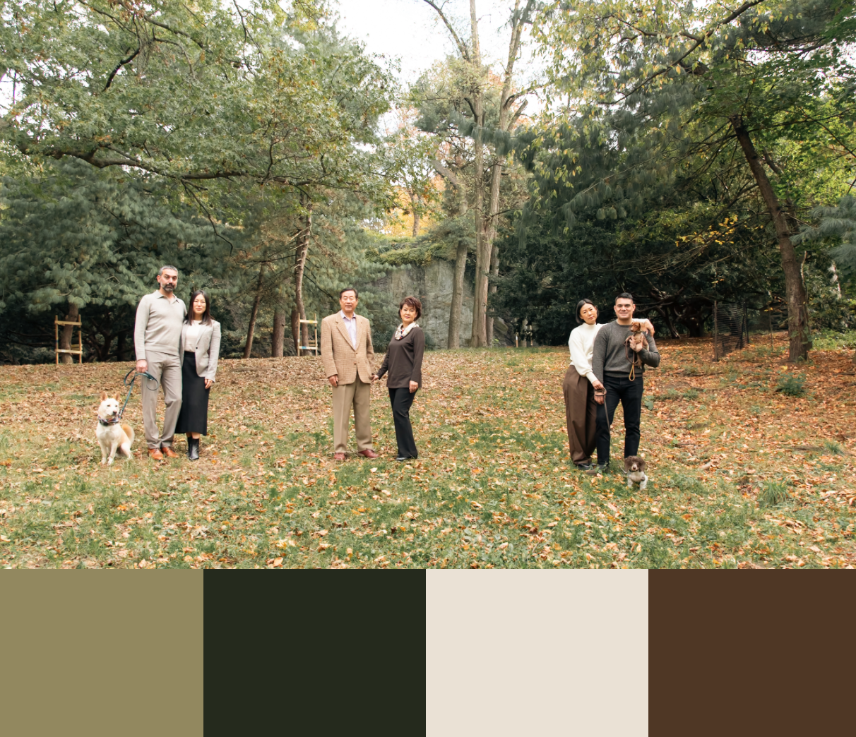 Family spending time together in a leafy park during fall season.