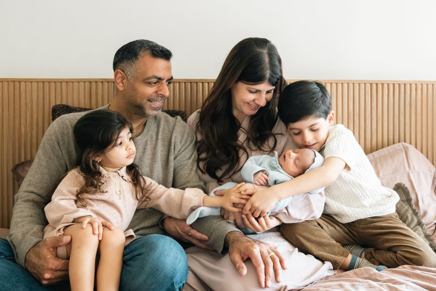 Candid family photography series showing relaxed moments of bonding at home.
