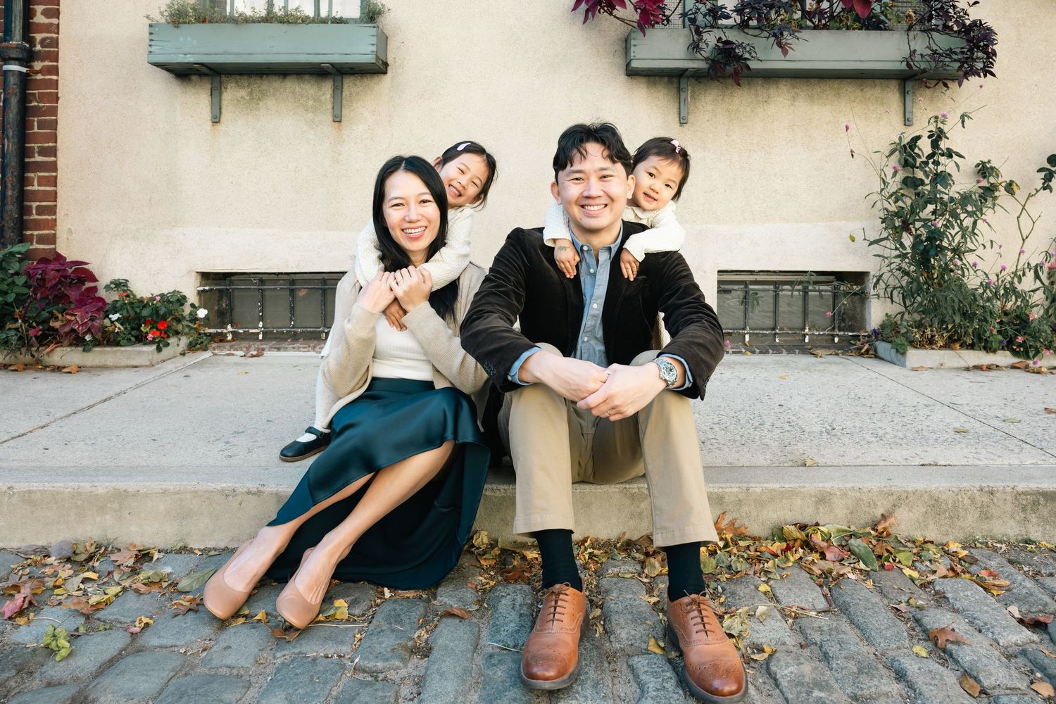 A collection of casual outdoor photos showing intimate family moments against an urban backdrop.