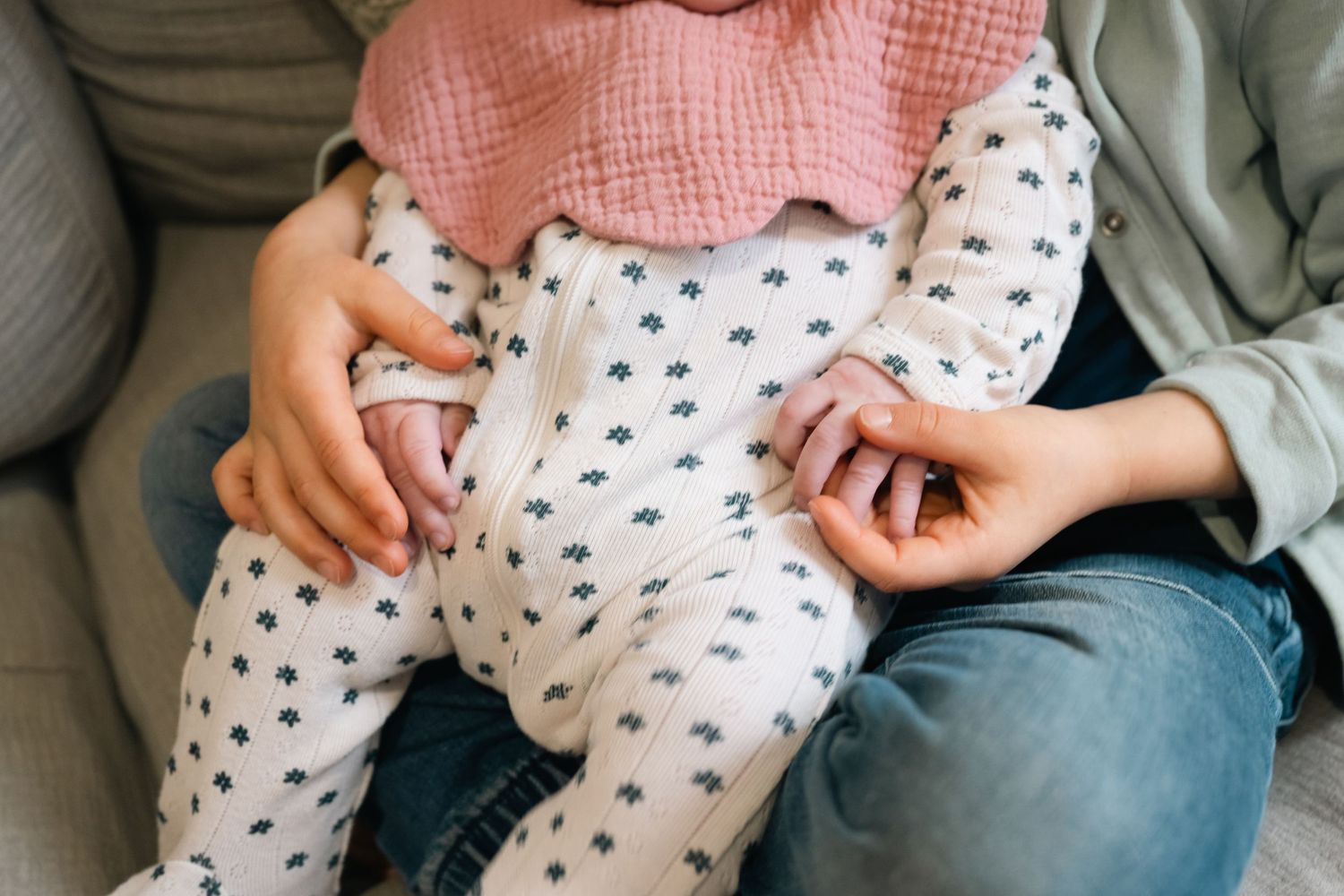 Casual family photography session showing intimate moments between sibling and child.