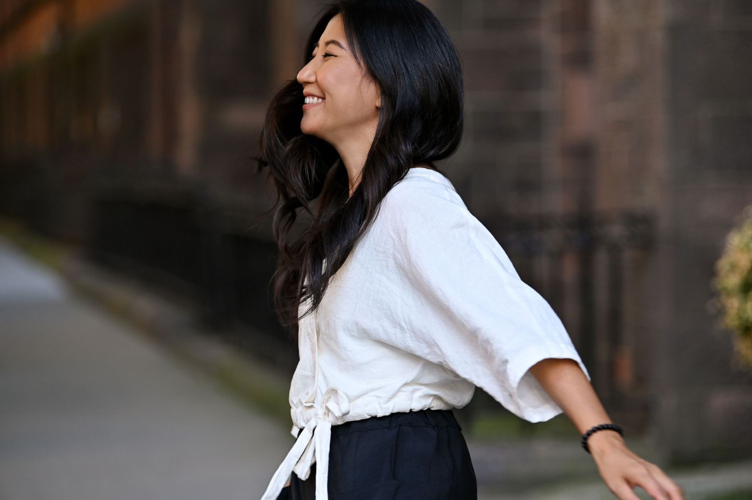 A series of candid lifestyle photos showing joyful moments and laughter against a brick wall background.
