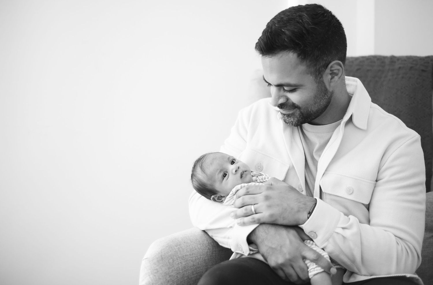 Series of emotional black and white photographs showing tender parent-child moments.