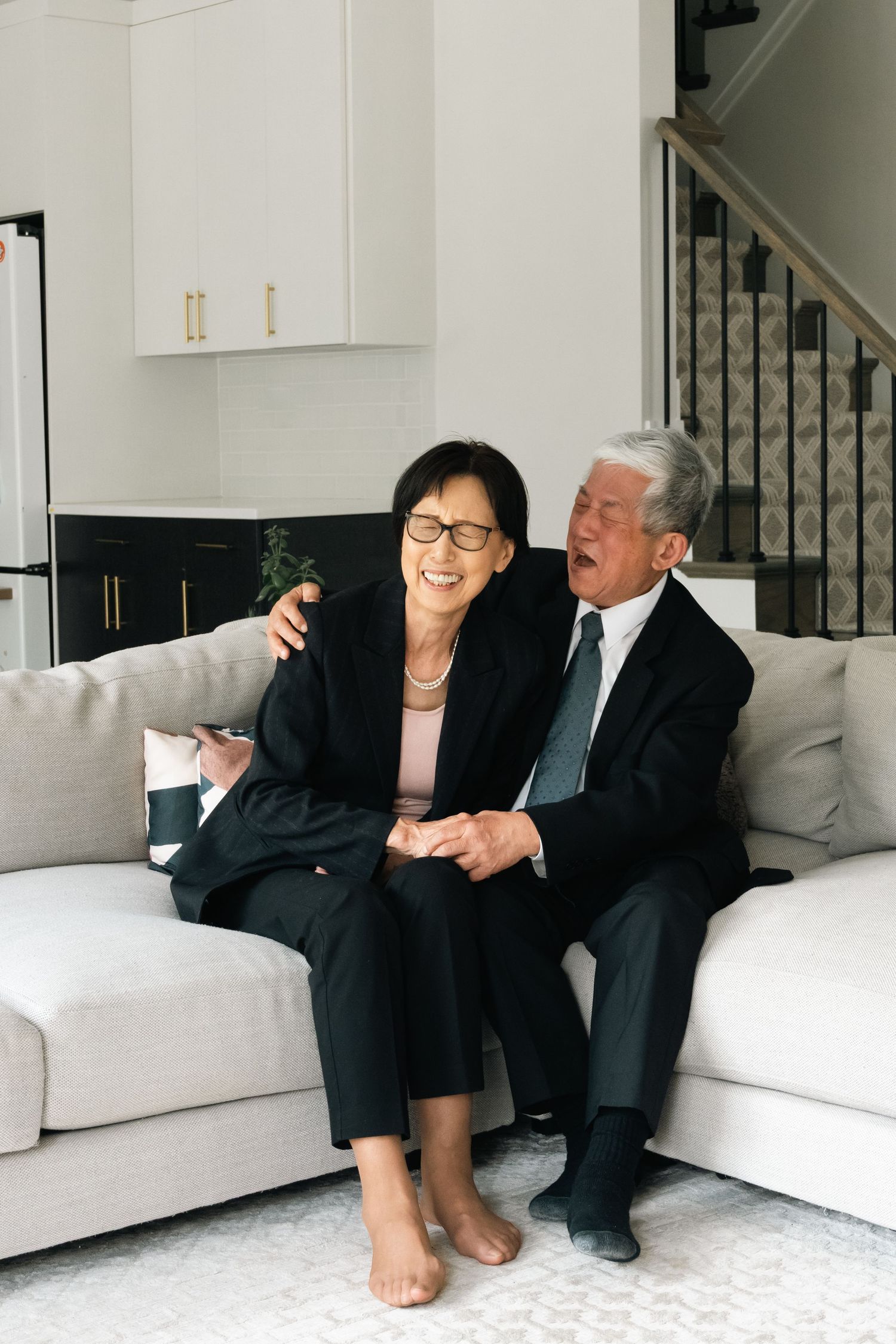 Series of candid moments between people relaxing on a white sofa.
