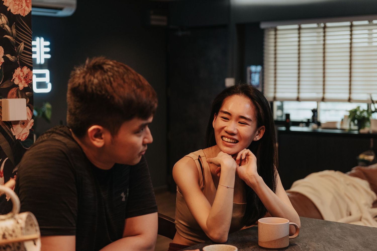A casual coffee date scene with warm lighting and modern cafe decor.