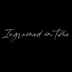 White text that reads 'Ingrained In Time' written in a handwritten style against a black background.