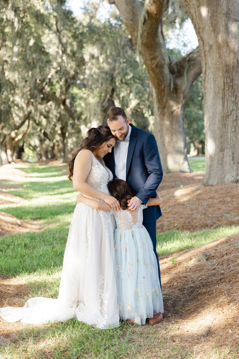 Intimate wedding ceremony under the Avenue of Oaks on St. Simons Island near Sea Island, captured by photographer in the Golden Isles.