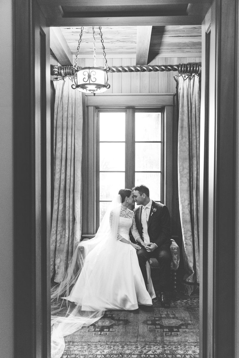 Classic black-and-white photo of bride and groom at Frederica Golf Clubhouse, St. Simons Island wedding photography capturing timeless elega