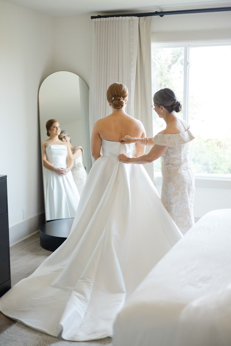 Bride getting ready in the bridal suite at Sea Palms Resort on St. Simons Island, GA captured by a local wedding photographer.