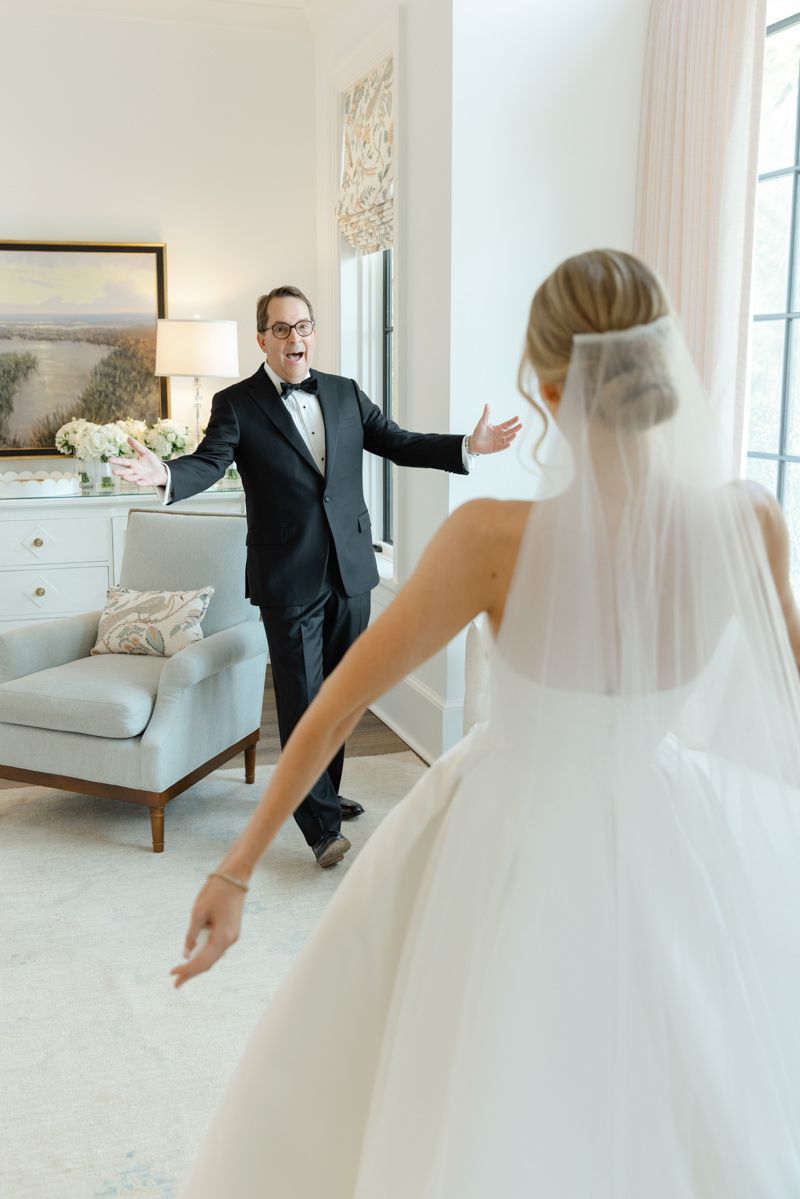 Bride and her father’s first look at Forbes Farm on St. Simons Island during a luxury wedding, captured by photographer in Georgia.