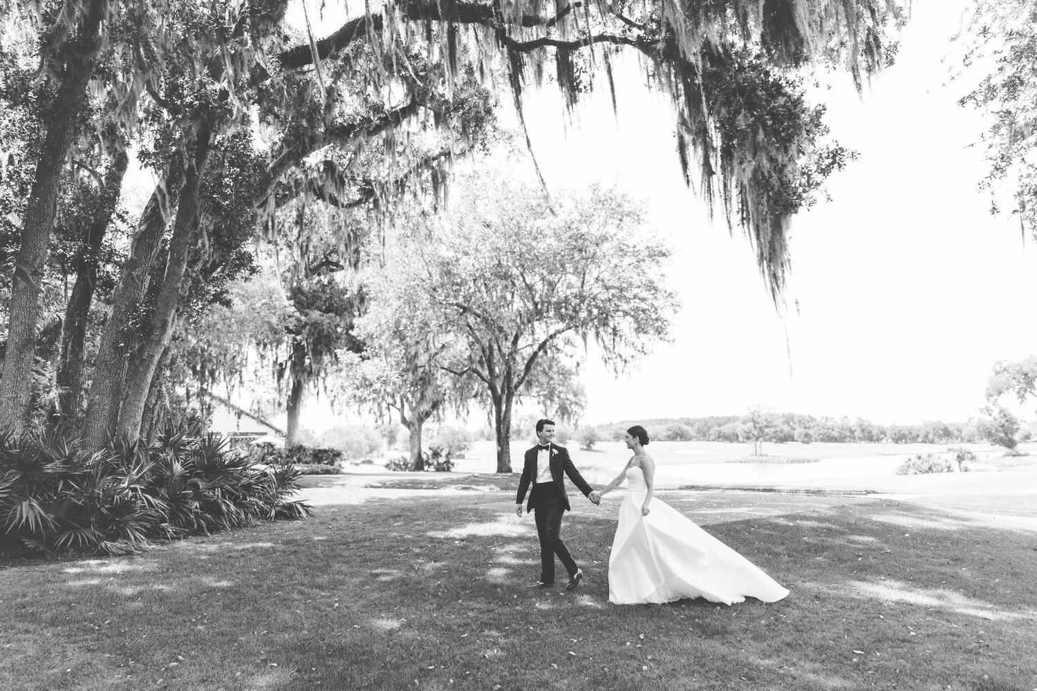 Dramatic bride and groom photo at Frederica Golf Club, St. Simons Island Sea Island wedding captured with film-style aesthetic.