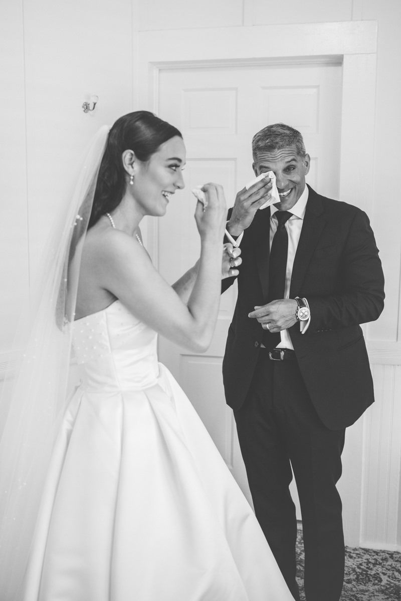 Emotional father first look with the bride at the King and Prince Resort on St. Simons Island. Candid, editorial-style photo.