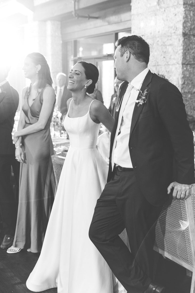 Candid photo of a toast during the wedding reception at Frederica Golf Club on St. Simons Island, captured by wedding photographer.