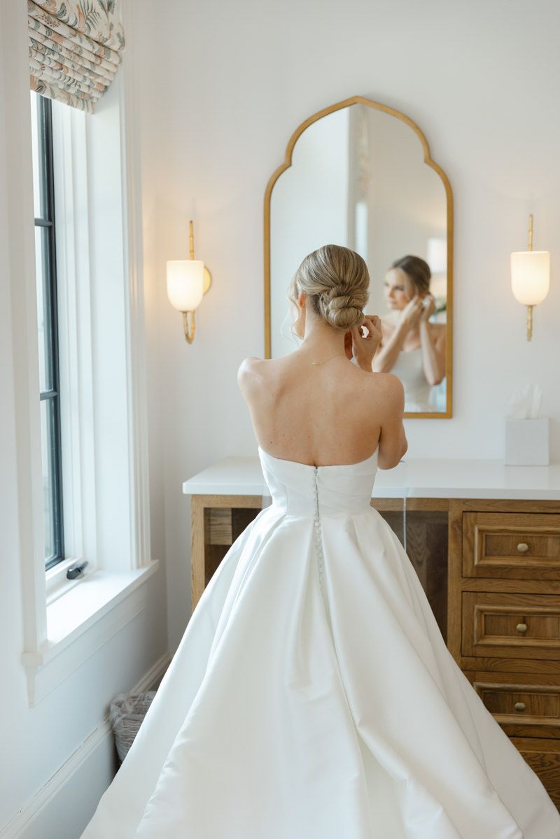 Bride getting ready in the bridal suite at Forbes Farm, a luxury wedding venue on St. Simons Island in the Golden Isles.