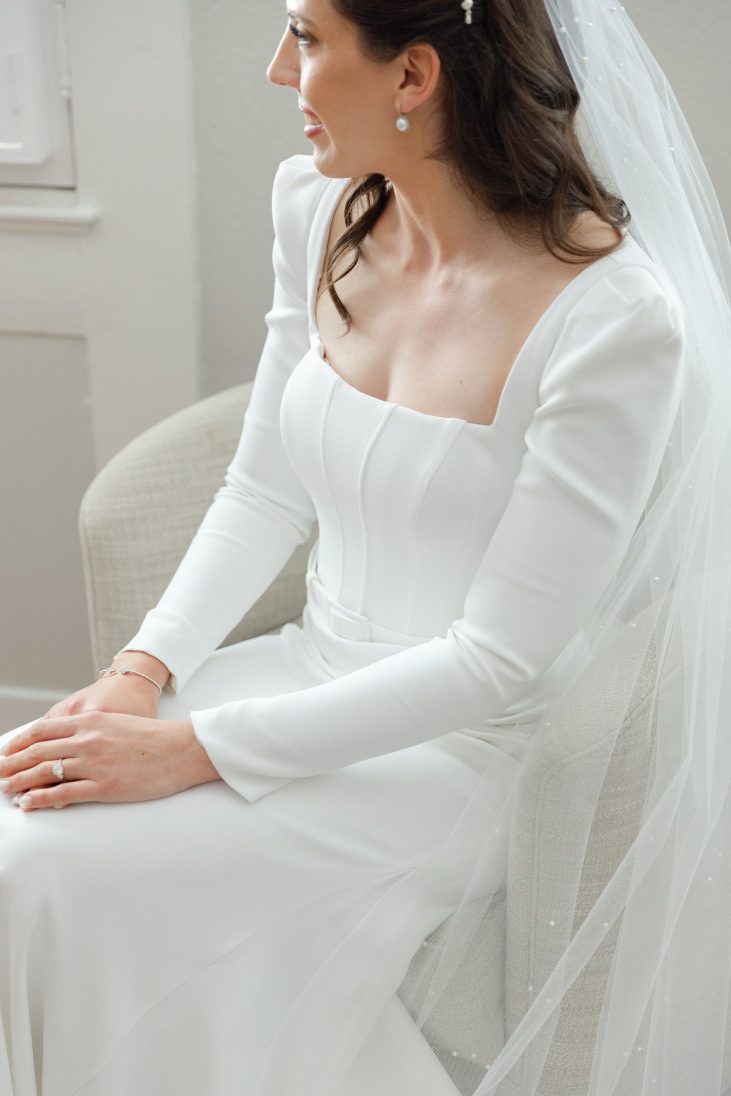 Luxury wedding photographer capturing bride getting ready at Crane Cottage, Jekyll Island Club Resort, Georgia—timeless elegant style.