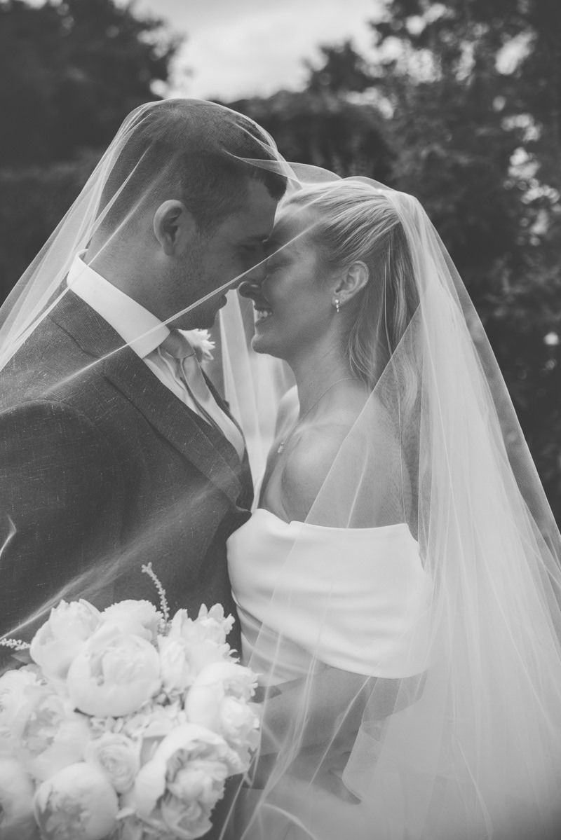 Art-inspired wedding photography of bride and groom at Crane Cottage, Jekyll Island Club Hotel, captured with timeless editorial style.