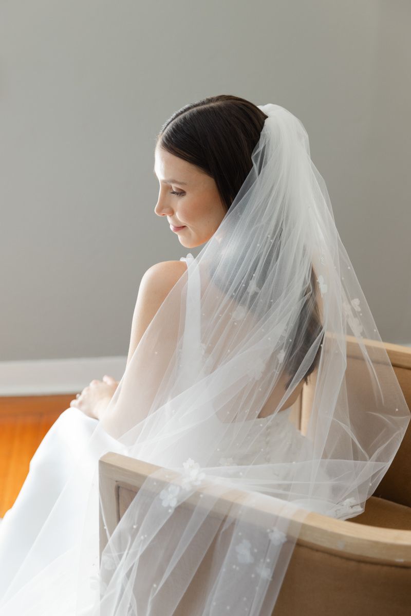 Art-inspired bridal portrait in film-style documentary photography at Jekyll Island Club Resort, Georgia.