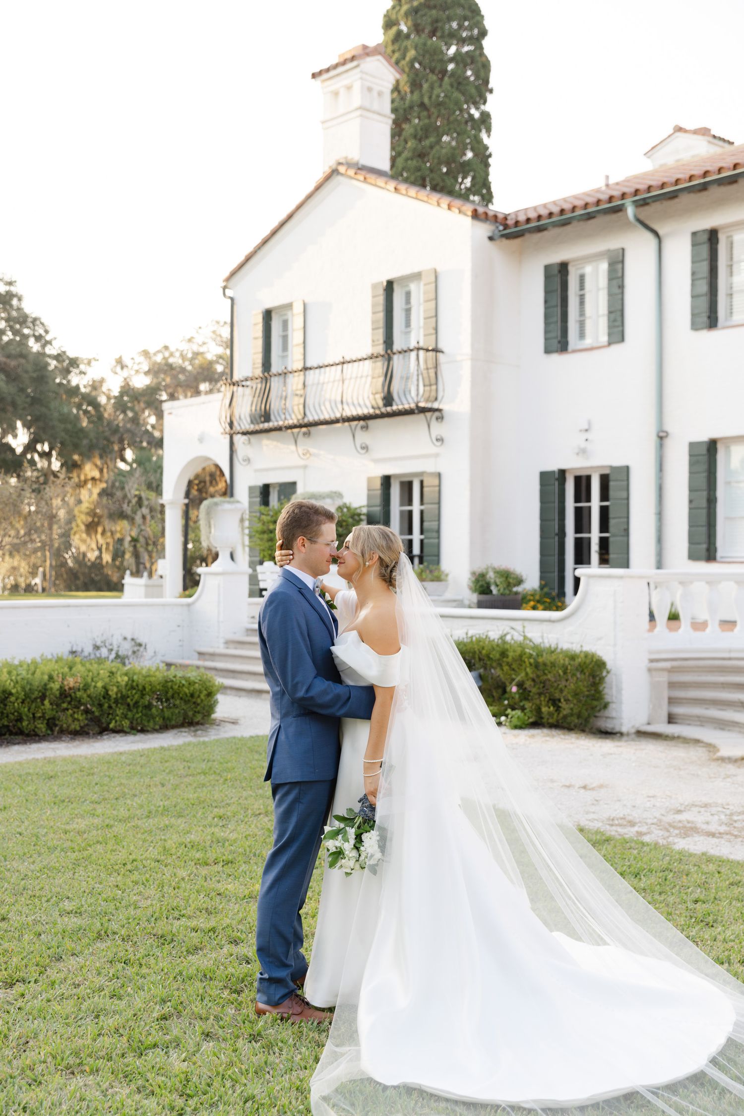 Elegant bride and groom in the Sunken Garden at Crane Cottage, Jekyll Island Club, Georgia—romantic wedding portrait with timeless charm.