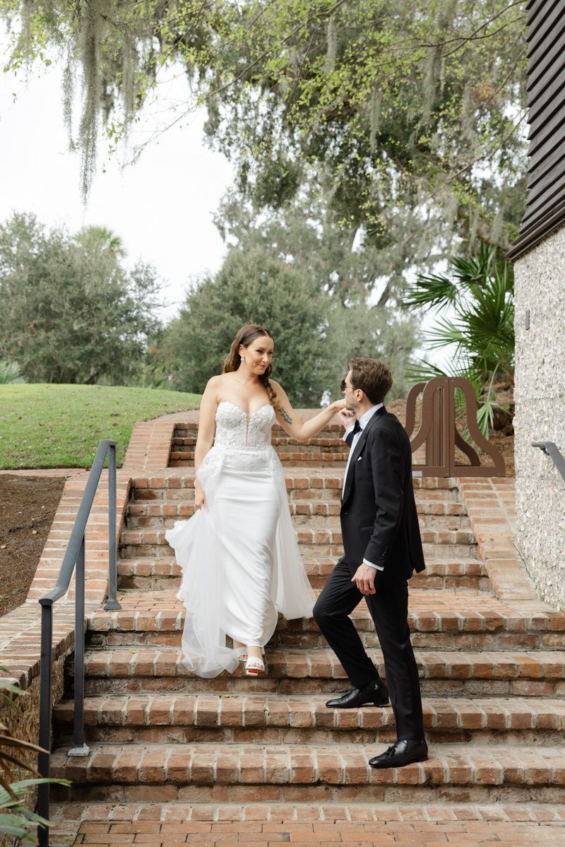 Bride and groom walking to their reception at Frederica Boathouse, St. Simons Island wedding.