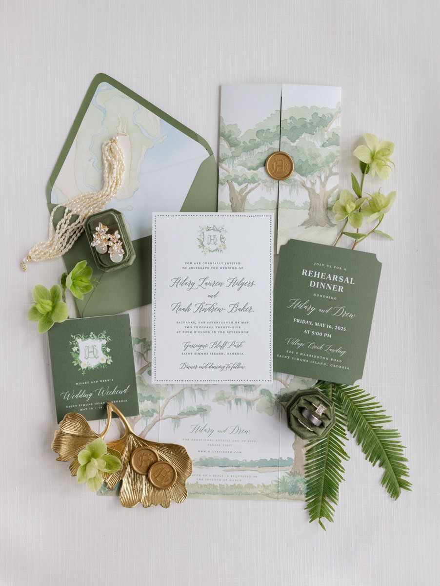 Luxury wedding invitation flat lay photographed on St. Simons Island, showcasing elegant paper goods and styling details.