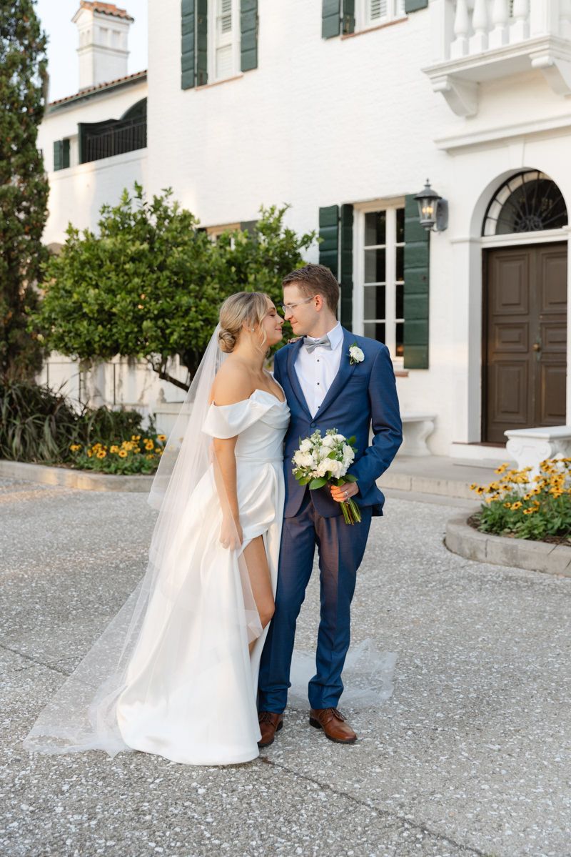 Bride and groom portraits in front of cottage at Georgia wedding venue, candid couple photo inspo.