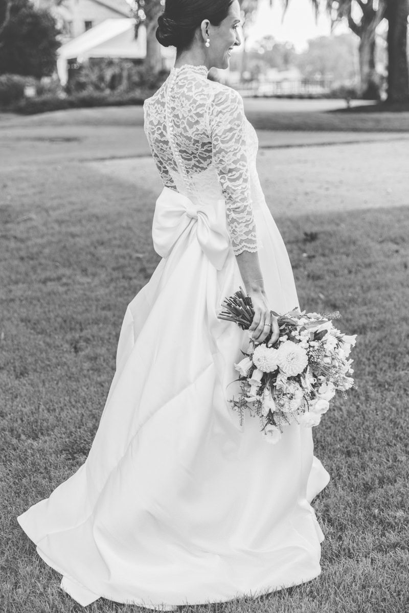 Fashion-forward bridal photo showing the back of the dress, high-end wedding inspo for brides looking for chic, modern photography.