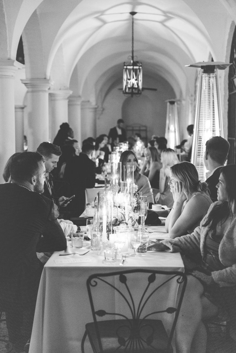 Editorial-style courtyard reception at Crane Cottage on Jekyll Island with wedding guests, captured by wedding photographer.