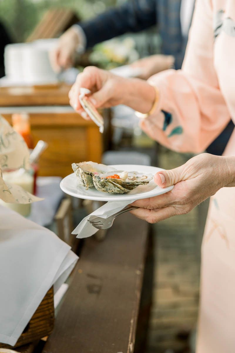 Lowcountry boil dinner at a Sea Island resort event. Candid, documentary-style wedding photography.