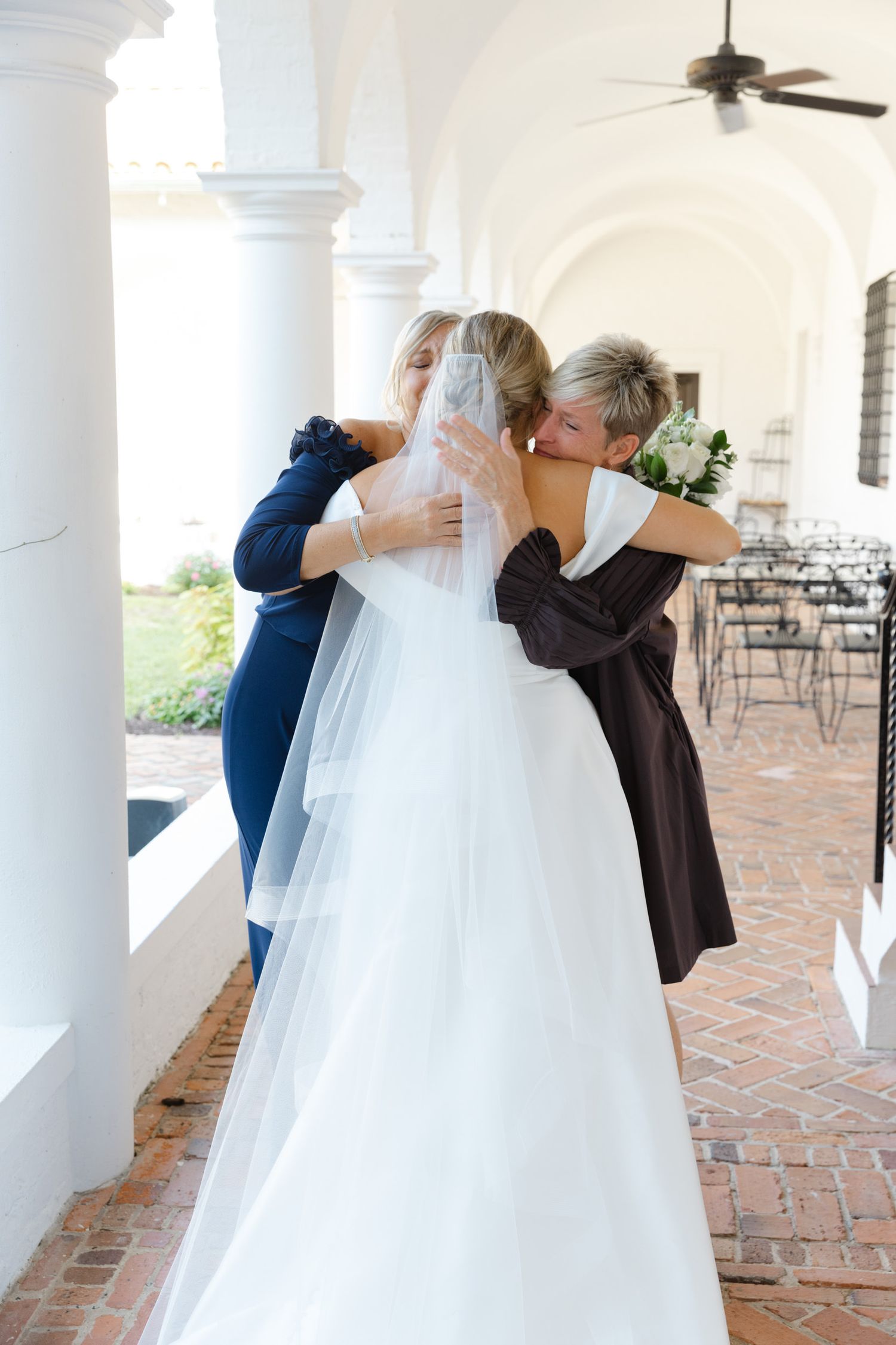 Candid wedding photography in documentary style at Jekyll Island Club, Georgia—captured by professional husband and wife photographers.