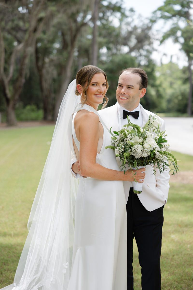 Happy bride and groom portrait at Forbes Farm, St. Simons Island. Captured by local wedding photographers.