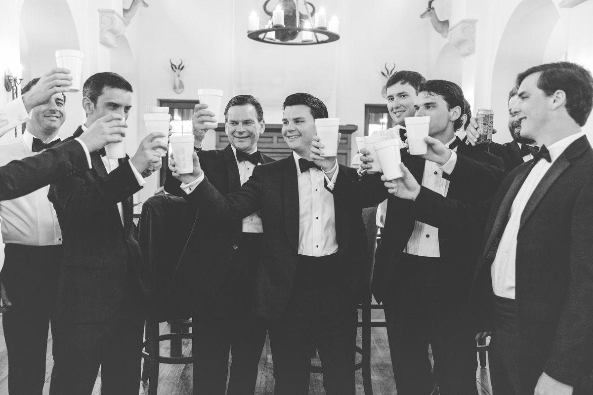Groom and groomsmen getting ready at Frederica Golf Club, St. Simons Island. Candid, documentary-style wedding photo.