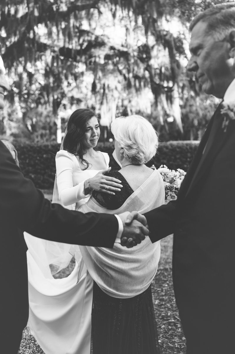 Emotional, film-inspired candid of bride and her mother at Faith Chapel on Jekyll Island, captured by wedding photographer.