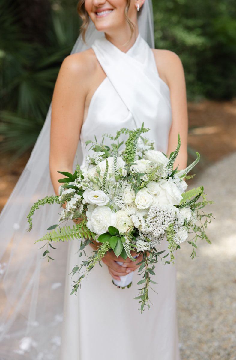 Bride with her bouquet at Forbes Farm, St. Simons Island. Film-inspired, documentary-style luxury wedding photography.