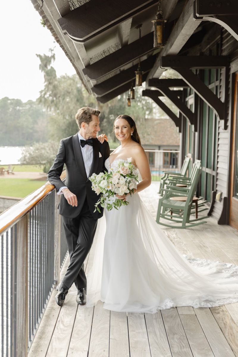 Fashionable bride and groom portrait at Frederica Golf Club Boathouse on St. Simons Island, Georgia, a luxury wedding venue for ceremony and