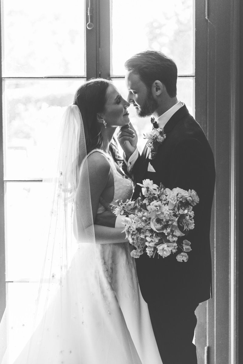Romantic candid of bride and groom about to kiss at Jekyll Island wedding, film-style couple photo inspo.