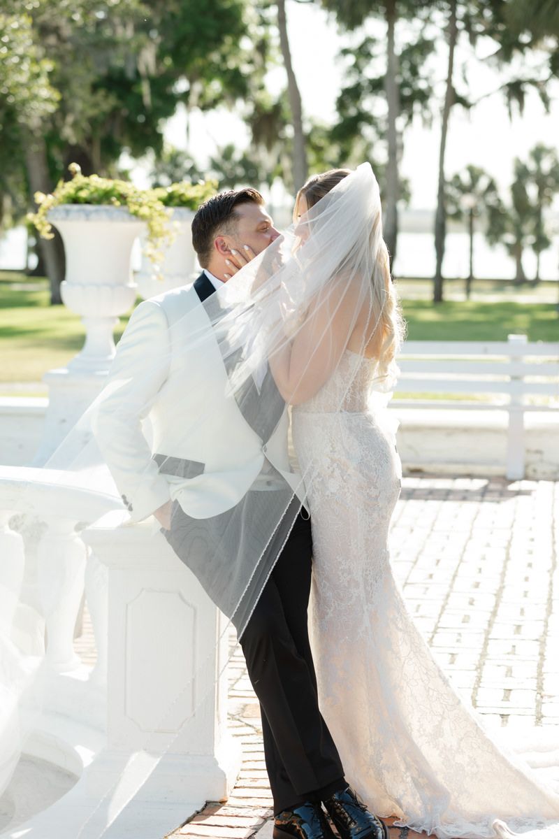 Documentary-style portraits of bride and groom at Crane Cottage, Jekyll Island Club Hotel Georgia, captured by wedding photographer.