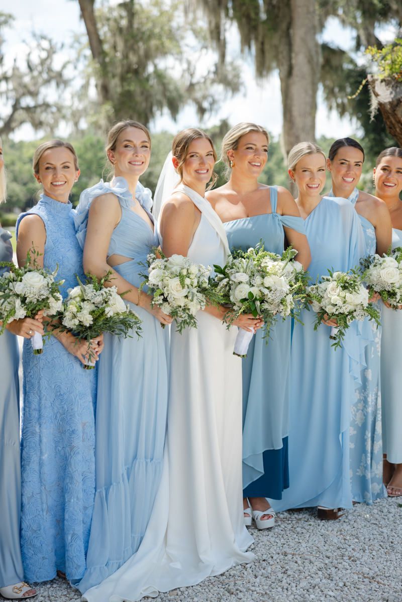 Bride and bridesmaids in elegant portraits at Forbes Farm, St. Simons Island. Captured by husband and wife photography team.