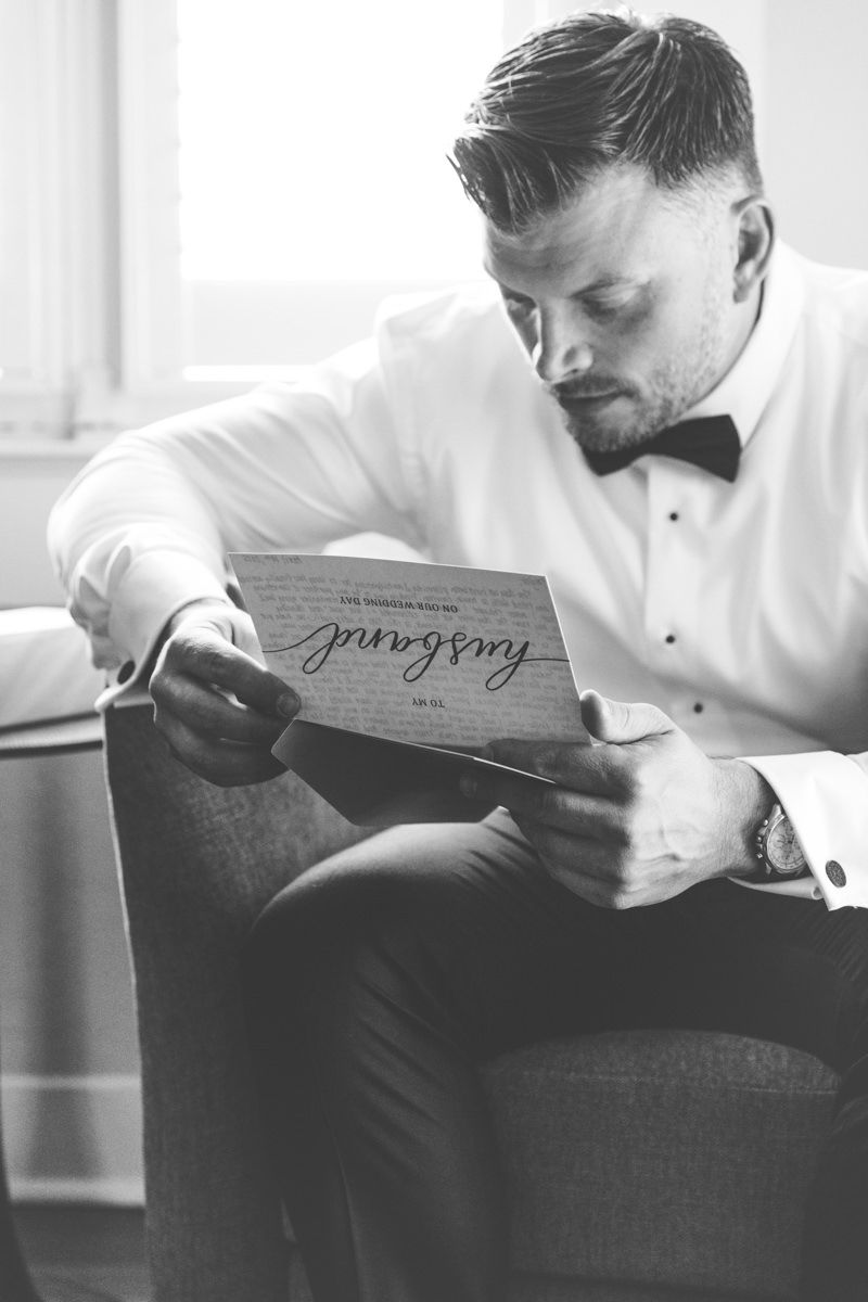 Groom getting ready at Crane Cottage, Jekyll Island Club. Candid, documentary-style wedding photography.