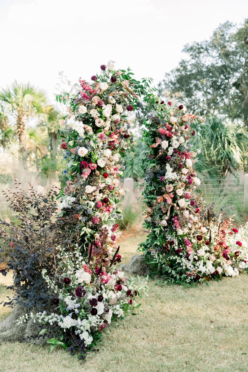 Gray Harper florals with a flower arch at Forbes Farm, St. Simons Island. Luxury wedding design by Savannah, Georgia florist.