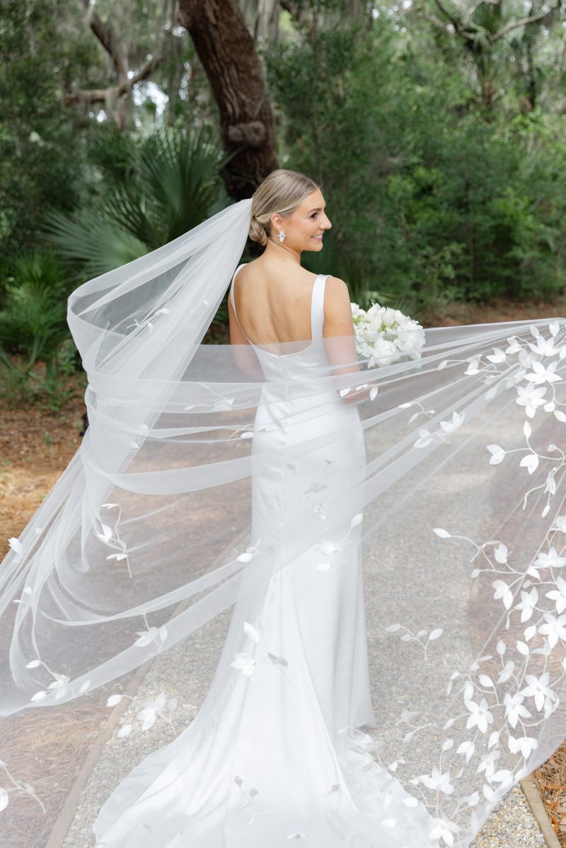 Elegant bride in a cathedral-length veil during bridal portraits at Forbes Farm on St. Simons Island.