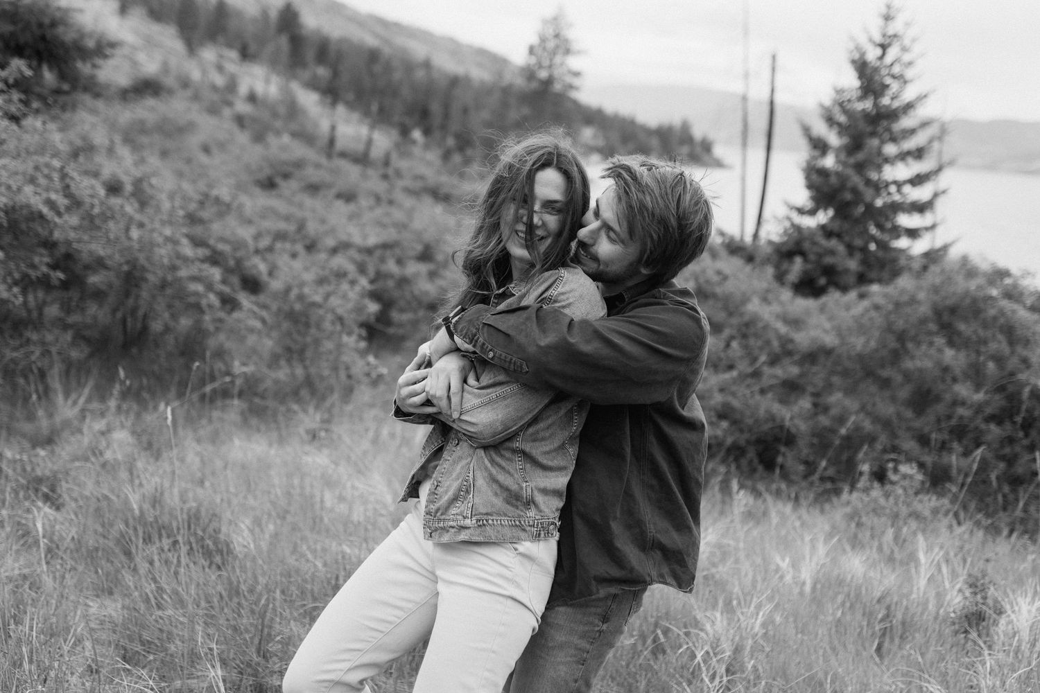 Black and white romantic portraits captured in a natural mountain setting.