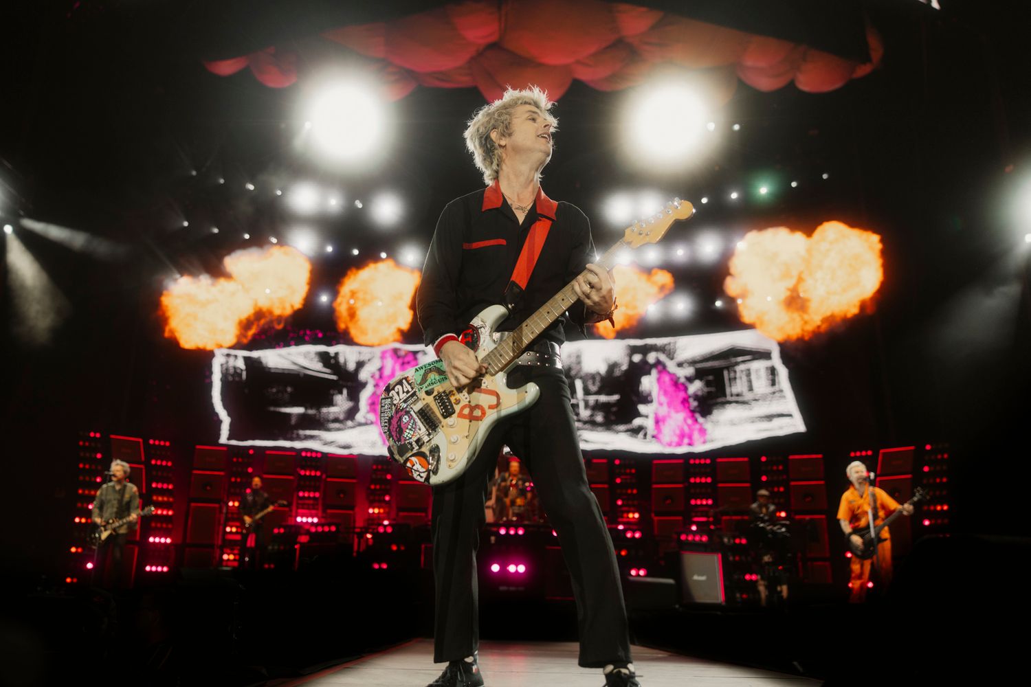 Billie Joe Armstrong on stage with fire bursts and stadium lights. High-energy concert photography for a Melbourne music portfolio.