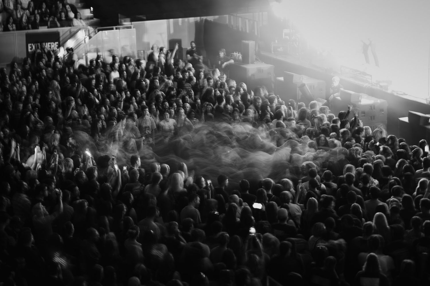 Artistic long exposure of a mosh pit circle at a heavy metal concert, captured by a Melbourne music photographer.