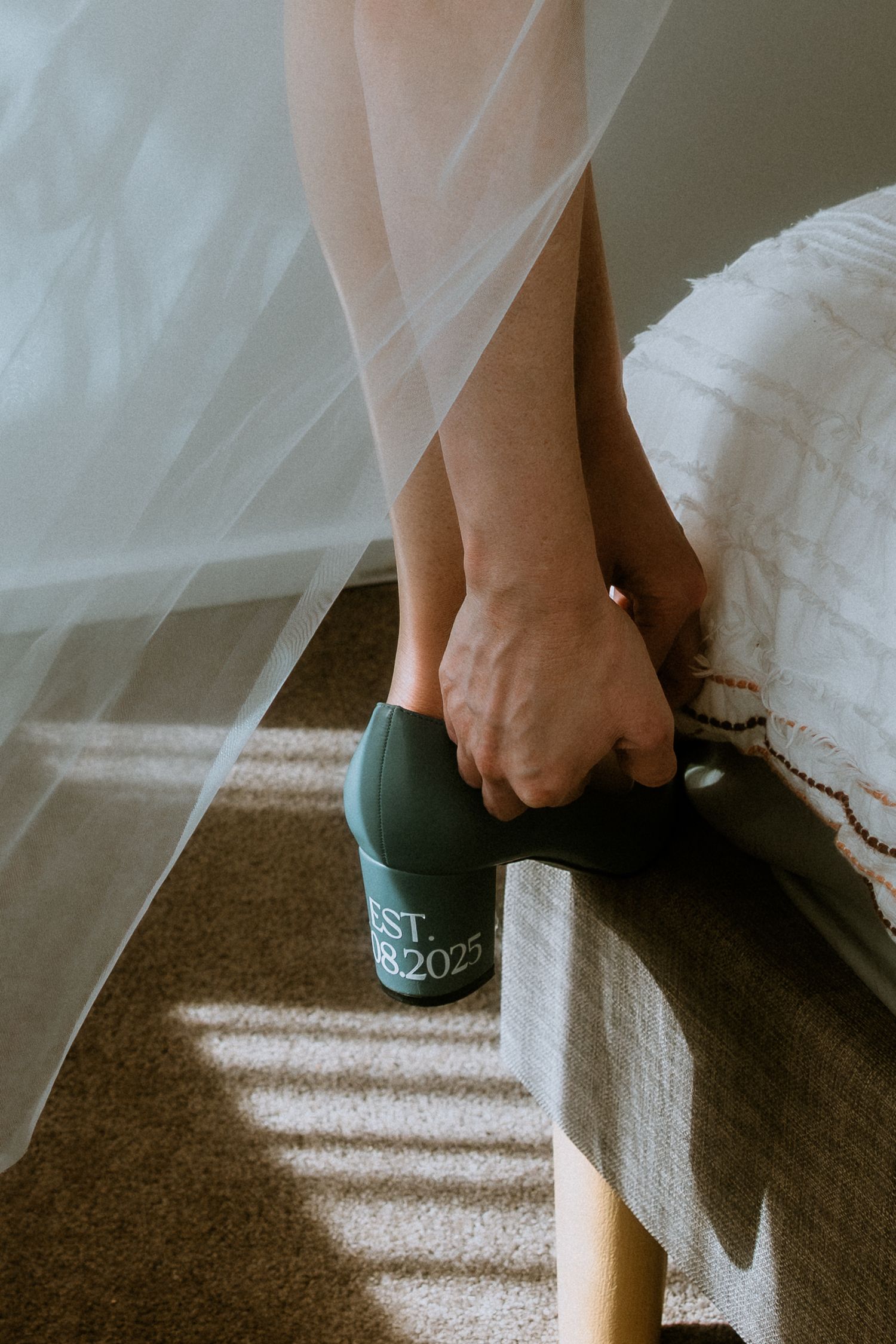 Close-up of bridal shoes featuring a custom 